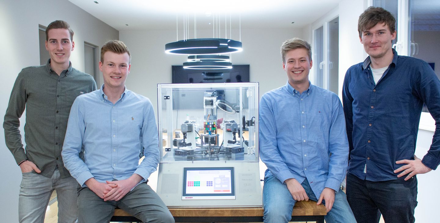 The team behind the Rubik's cube solving machine.